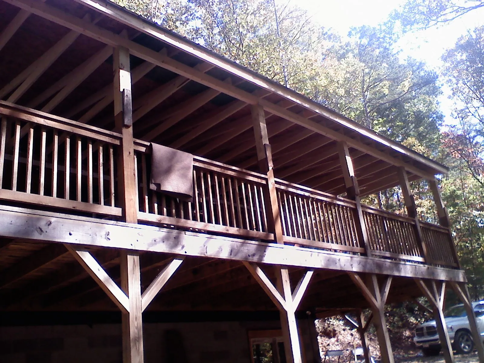 Timber framing under a new elevated porch and deck — Roof Leak Repair in Watford City by Roofing Brothers